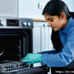 미니멀라이프 가전 제품 장기 사용 - A detailed interior view of a modern home appliance maintenance scene showing a person gently cleani...
